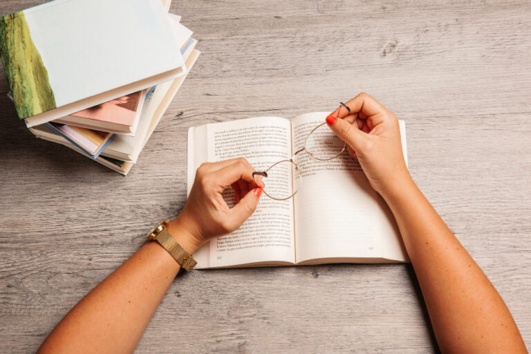 line by line editing, reading, hands with a book and glasses